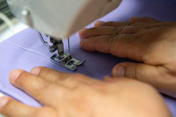 hands of sewing