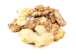 handful of dried ginger roots closeup on white