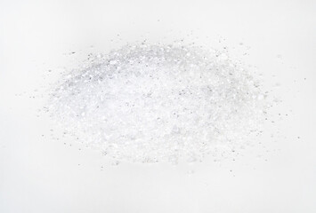 pile of crystalline citric acid closeup on white