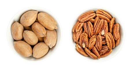 Pecan nuts, shelled and unshelled, in white bowls. Whole pecans and pecan halves, seeds and edible nuts of Carya illinoinensis, used as snack. Close-up from above isolated over white macro food photo.