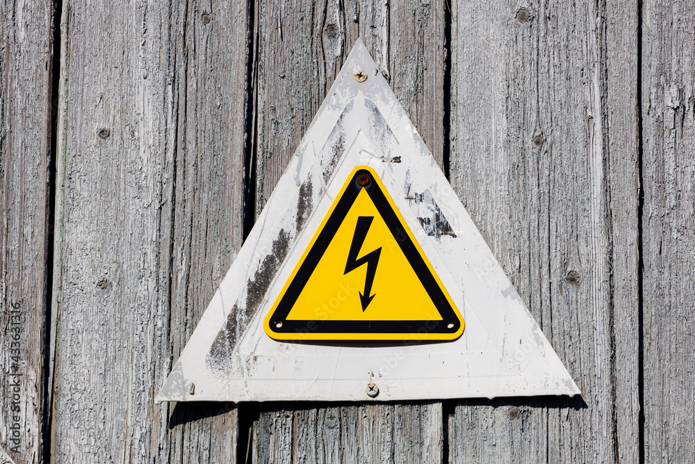 Poster yellow triangle with lightning. warning sign about the danger of electric shock