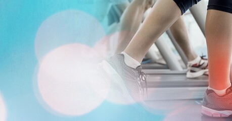 Composition of woman running on treadmill with red spot on calf showing injury over spots of light