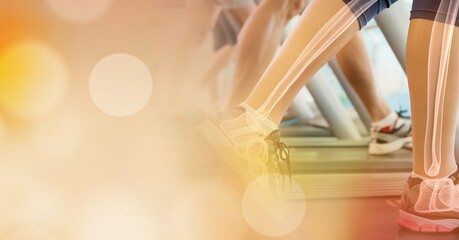 Composition of spots of light over woman running on treadmill with bones showing