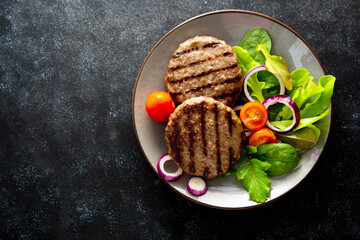 Cooked minced beef patty with vegetables. Copy space