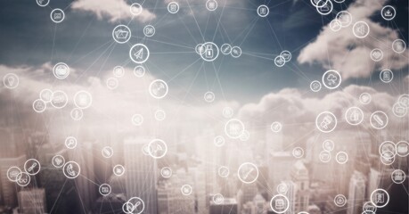 Composition of network of digital icons over cityscape in background