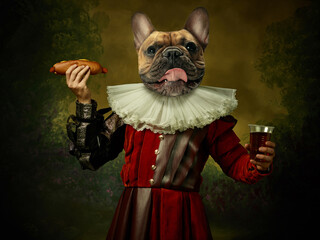 Model like medieval royalty person in vintage clothing headed by dog head on dark vintage...
