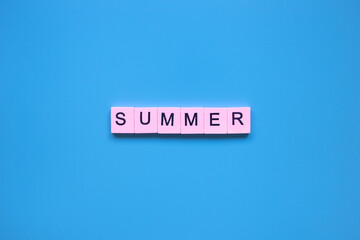 Summer word on a blue background.