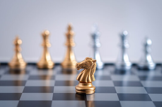  gold  knight Against whithe background, International chess, ideas and competition and strategy, chess board game competition business concept.