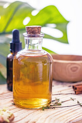 Natural organic herbal wellness cosmetics. Cosmetic oil in a bottle with a stopper, close-up