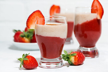 sweet strawberry yoghurt milkshake in glasses, closeup