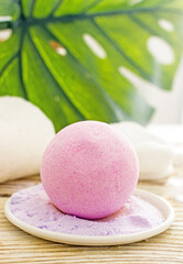 Salt pink bath bomb with lavender close-up. Natural cosmetics handmade background
