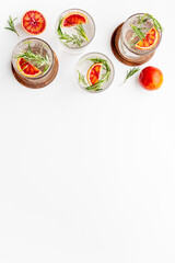 Citrus juice and slices of grapefruit and red oranges. Overhead view
