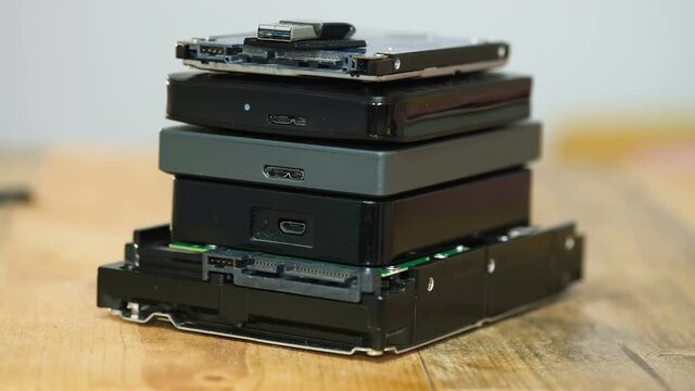 Pile of hdd memory storage devices over dark surface,tech components,usb,memory
