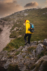 Mountain climbing. Woman with backpack and sport clothing hiking outdoors in natural park Mala fatra, Slovakia