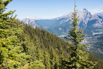 Beautiful aerial view of Rocky Mountains and Banff on a sunny day. Alberta