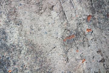 Abstract grunge concrete gray uneven texture. Promotional loose gray wallpaper with space. 