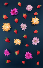 Navy black Summer concept of fresh colorful flowers and delicious strawberries. Creative tropical background...