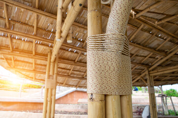 Knot tied to a pole Bamboo house. Stilt wooden houses using ropes instead of nails. View outside Vintage folk building in Thailand. Building house with natural materials. Eco earth concept