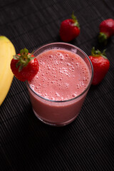 Milkshake with strawberry and banana. Fresh fruit and vitamins, idea of snack or breakfast.