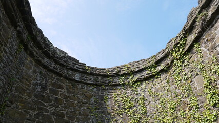 Blue sky above a stone castle turret © Chlo&Sam Photography