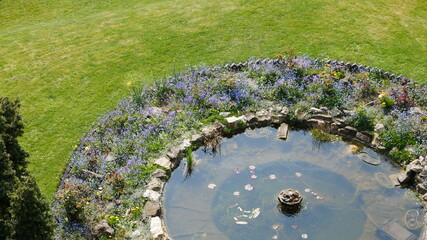 An ornate circular pond in a garden