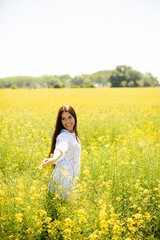 Young woman in the rapeseed field