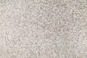 The background is made of gray granite with beautiful splashes of lilac color. Backgrounds design textures.