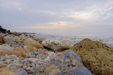 Fototapeta na wymiar Magical sunset background natural colours crashing wave Cyprus landscape beach sea stone . High quality photo