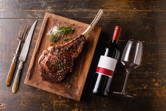 Grilled Tomahawk Steak And Bottle Of Wine