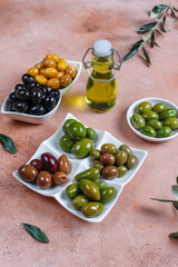 Variety of green and black whole olives.