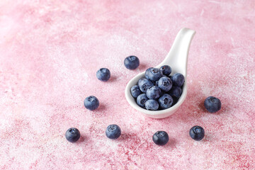 Fresh organic blueberry fruits in a bowl.
