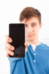 Young Man show a Phone
