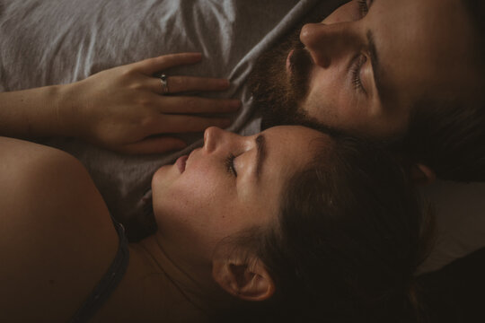 Close up of caucasian couple in love sleeping together
