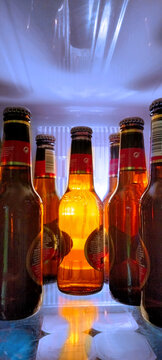 Lots Of Beer Bottles Inside The Fridge, One Of Them Especially Eye-catching