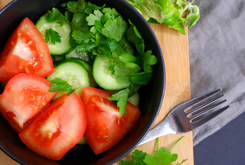 Vegetable salad on a wooden board.