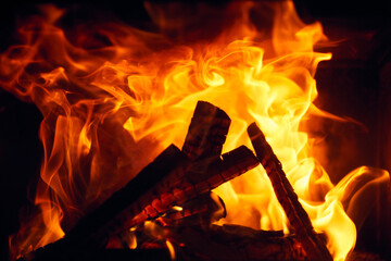 A fire burns in a fireplace, Fire to keep warm. Logs burning in