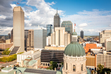 Drone view of the Indiana Statehouse and Indianapolis skyline. Indiana Statehouse houses the General Assembly, the office of the Governor, the Supreme Court, and other state officials.