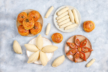 Fototapeta na wymiar Traditional Azerbaijan holiday Novruz sweets,shekerbura,qogal,paxlava,mutaki.