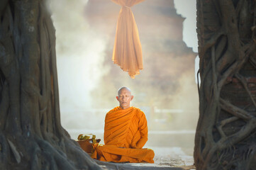 Monk Buddhist on during sunrise at temple, Thailand,vintage style