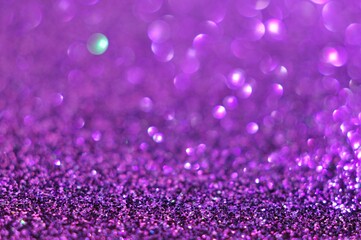 Abstract purple bokeh glitter on nature background