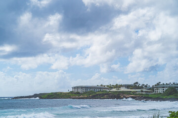 Fototapeta premium View of resort on tropical island against cloudy sky