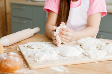 person kneading dough