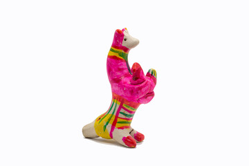 Fototapeta na wymiar clay multi-colored figurine of a dog with a puppy