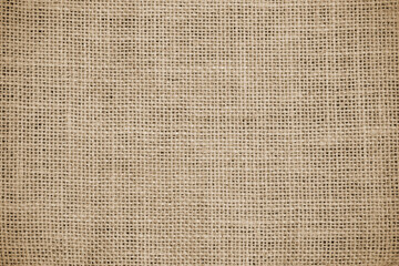 Plakat Hessian sackcloth burlap woven texture background, Cotton woven fabric close up with flecks of varying colors of beige and brown, with copy space for text decoration.