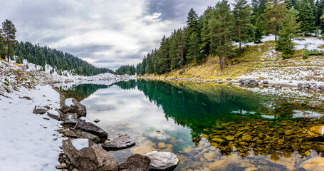 Fish Lake ( Balikgol ) snowy mountain in background in Savsat © nejdetduzen