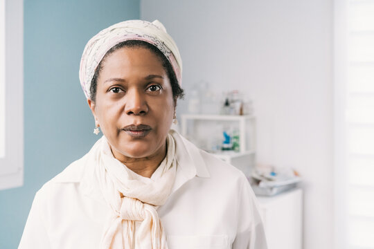 African American mature woman patient at clinic waiting for appointment during appointment