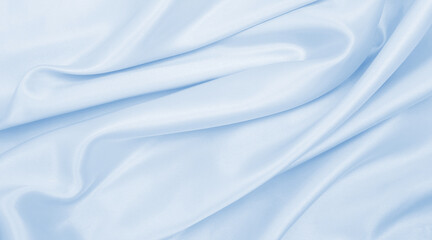 Smooth elegant blue silk or satin luxury cloth texture as abstract background. Luxurious background design