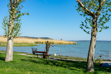 active old fischerman with a bench at lake Balaton