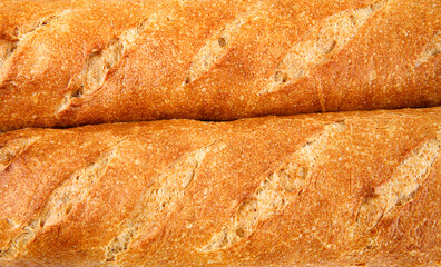 French baguette. A background of two baguettes. Art bread.