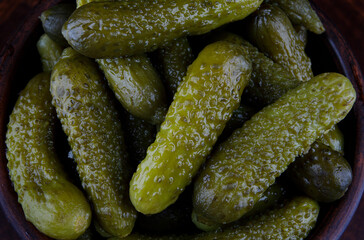 Background of a lot of pickled cucumbers. Salted cucumbers.